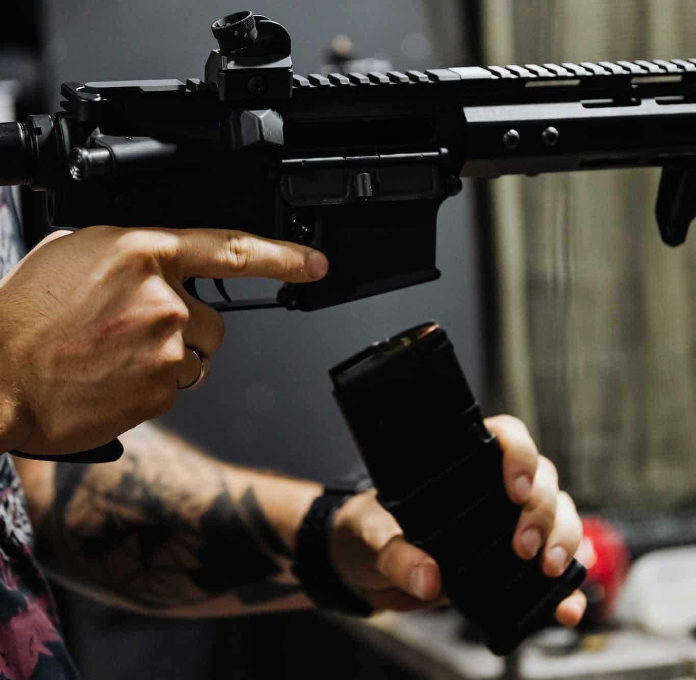 A Person Reloading a Rifle shtf plan and shtf loadout