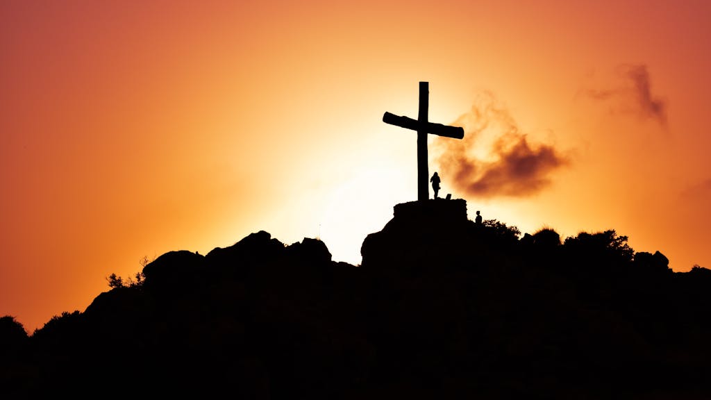 Christian Self-Discipline: A Practical Guide for the Man of Christ 2 Human Standing Beside Crucifix Statue on Mountain